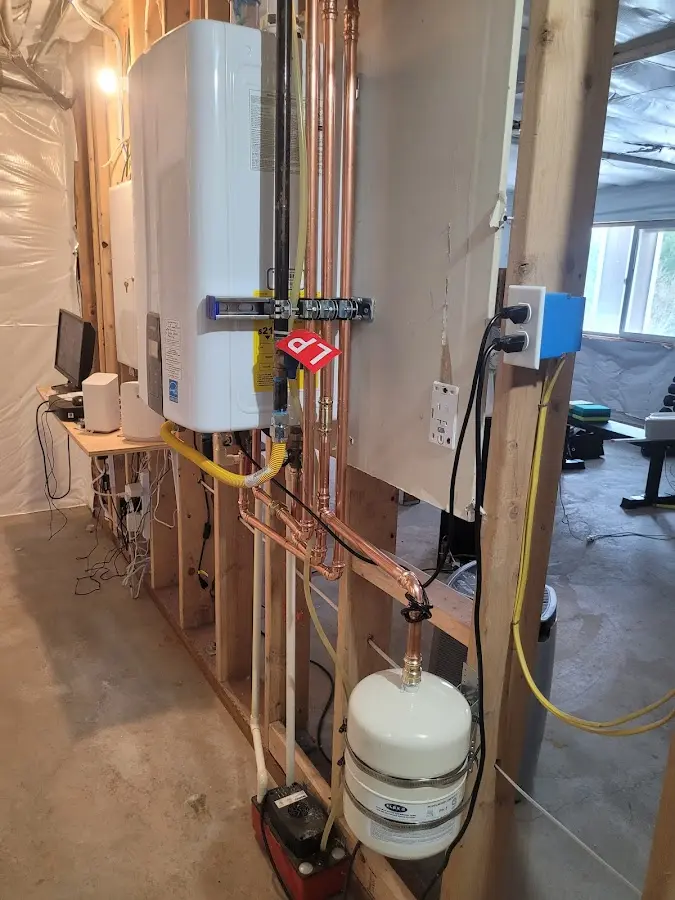 Licensed plumber repairing a kitchen sink in Glencoe